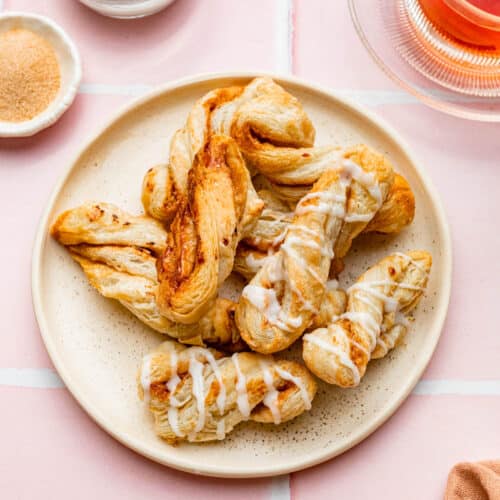 A plate full of cinnamon sugar pastry twists.