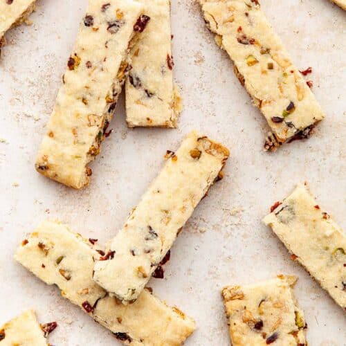Shortbread cookies with pistachios and cranberries, in bar-shapes.