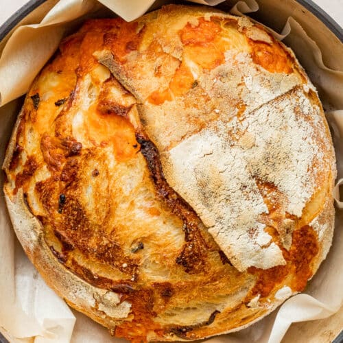 Sourdough bread in a pot, with cheese baked into the bread.