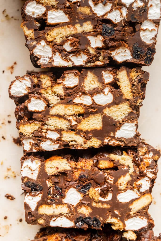 Close up of sliced rocky-road bars with marshmallows and cookies.