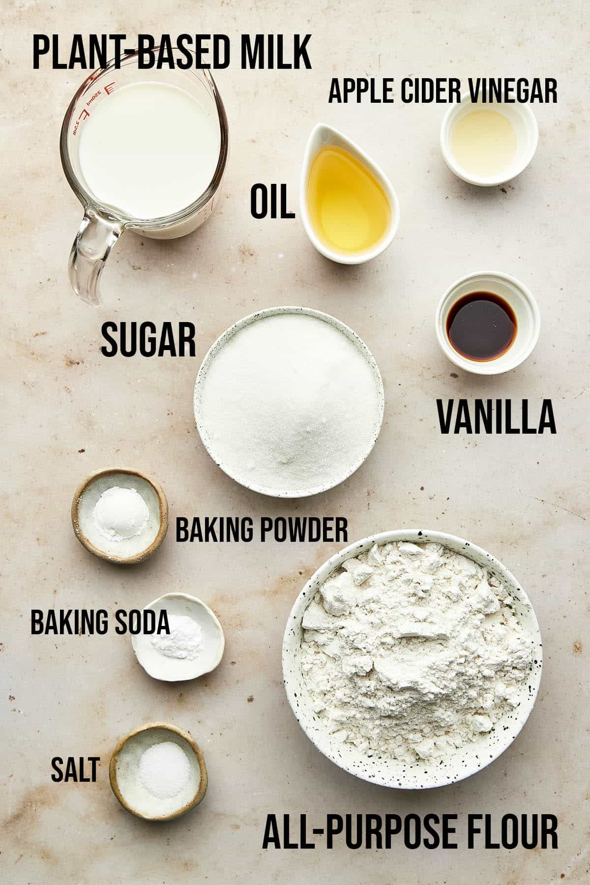 Vegan vanilla cake ingredients with labels.