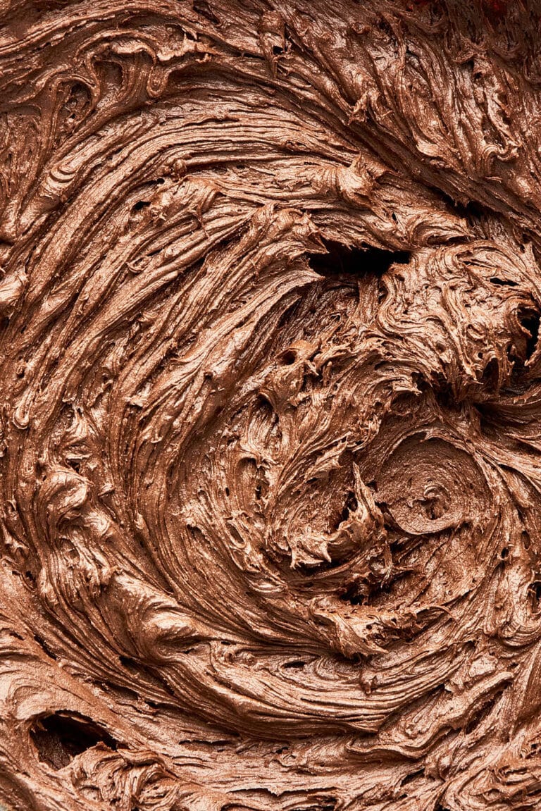 Close up of chocolate frosting after whipping in a bowl.