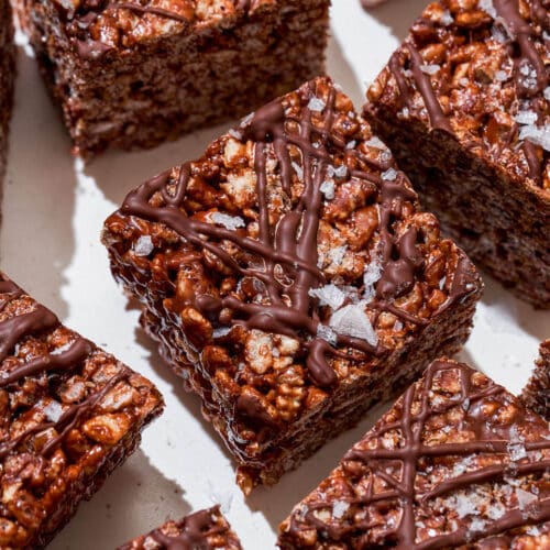 Chocolate cereal treats cut into squares, topped with more chocolate and salt.