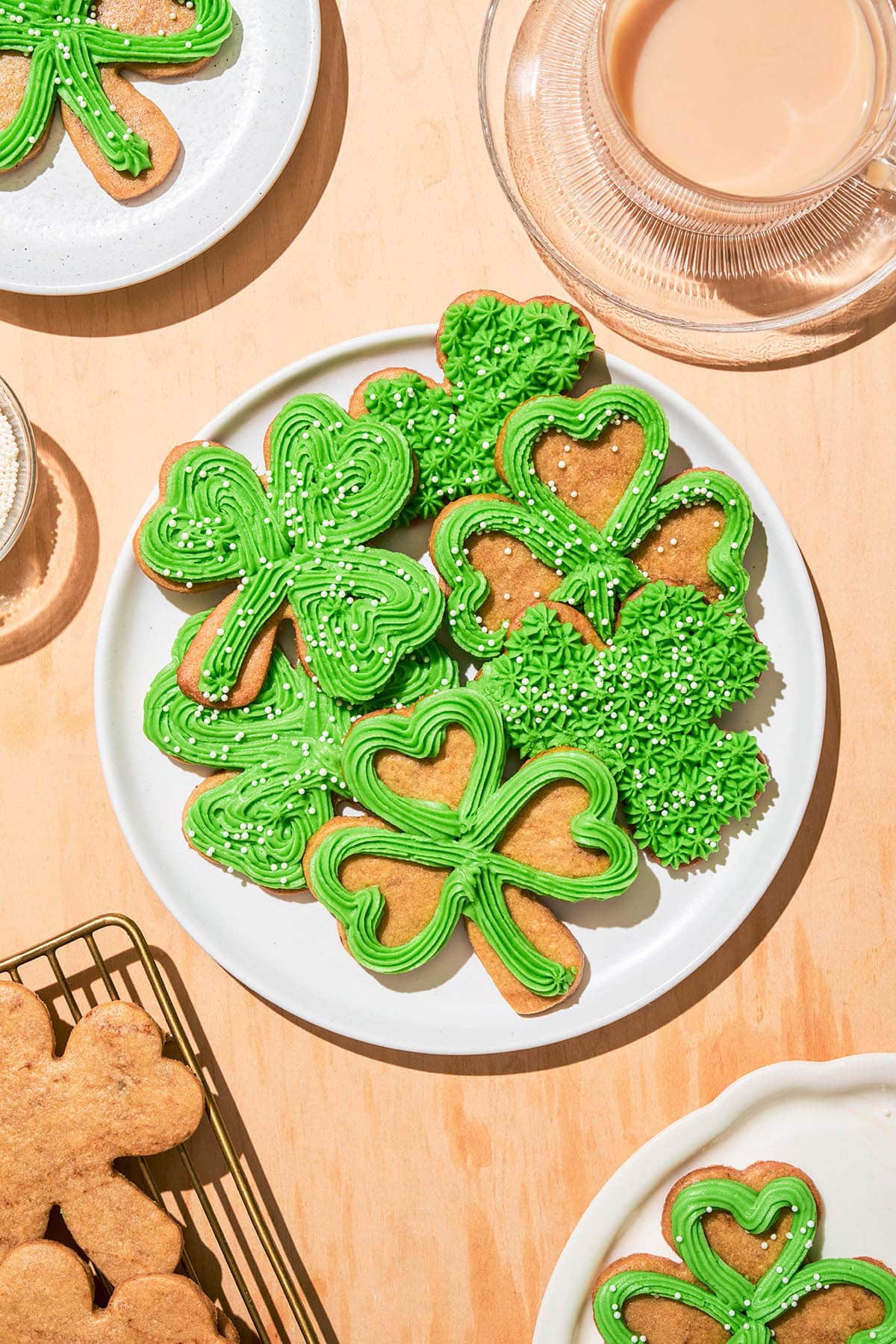 Lucky clover shaped cookies on a plate.