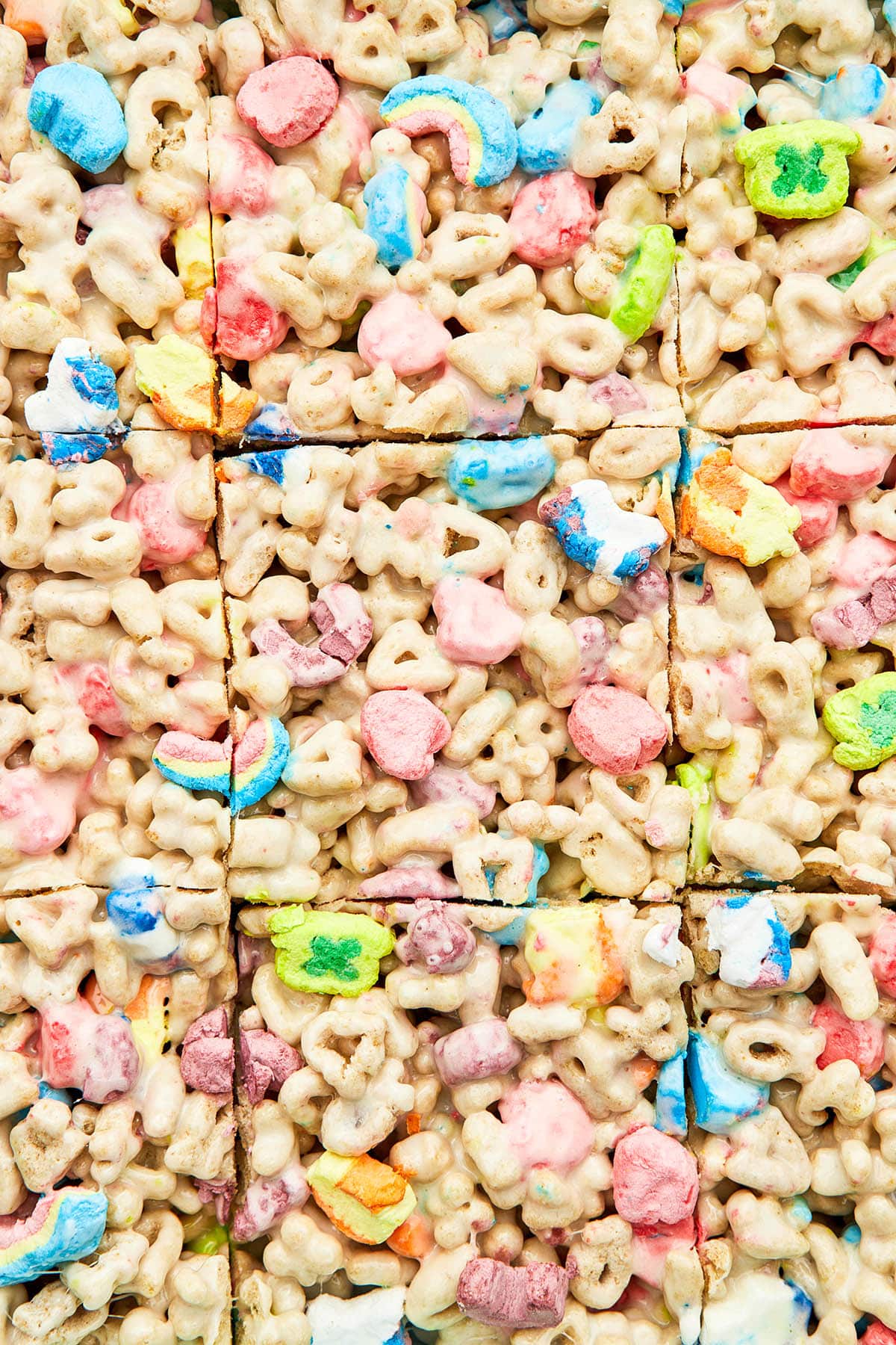 Close up of marshmallow treats cut into squares.
