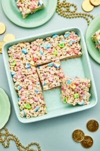 Cereal treats in a square baking dish, cut into squares.