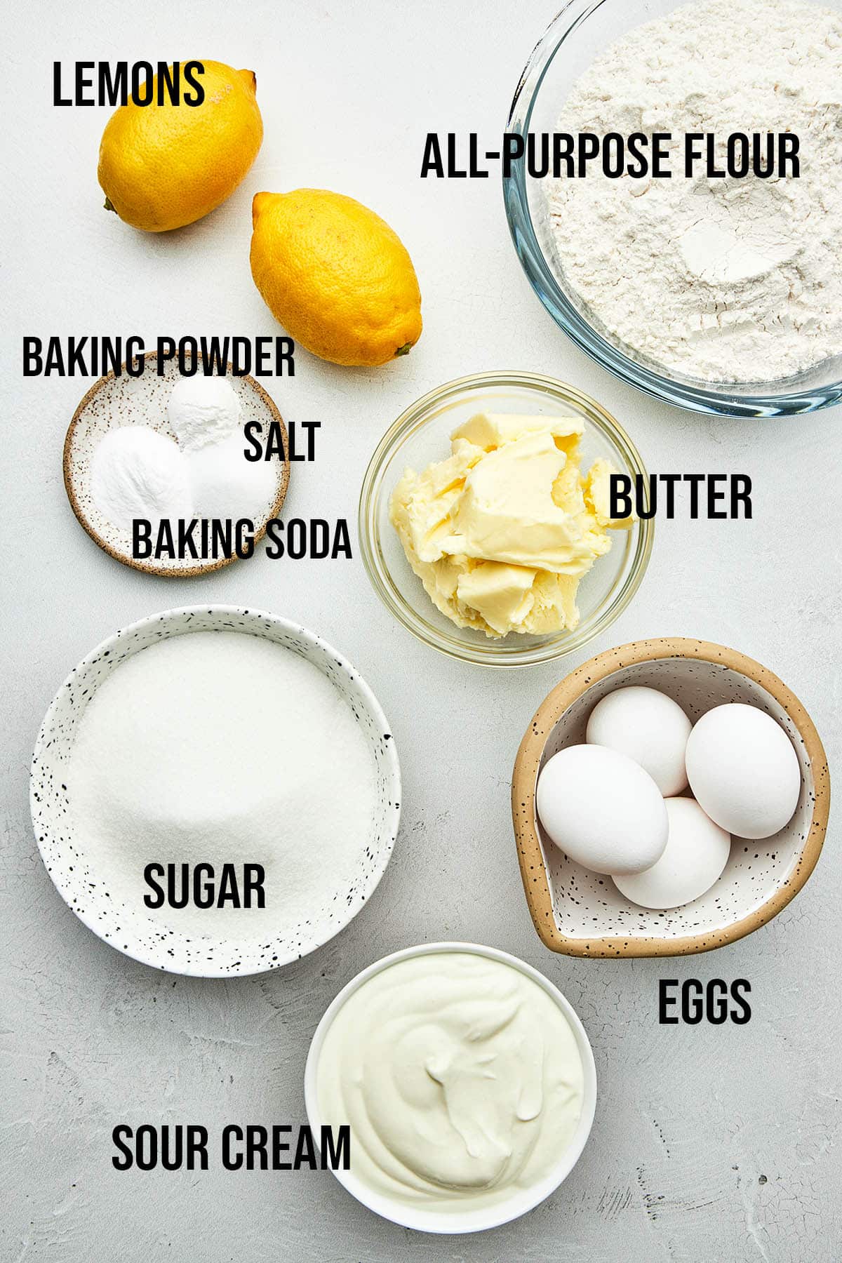 Lemon sour cream bundt cake ingredients with labels.