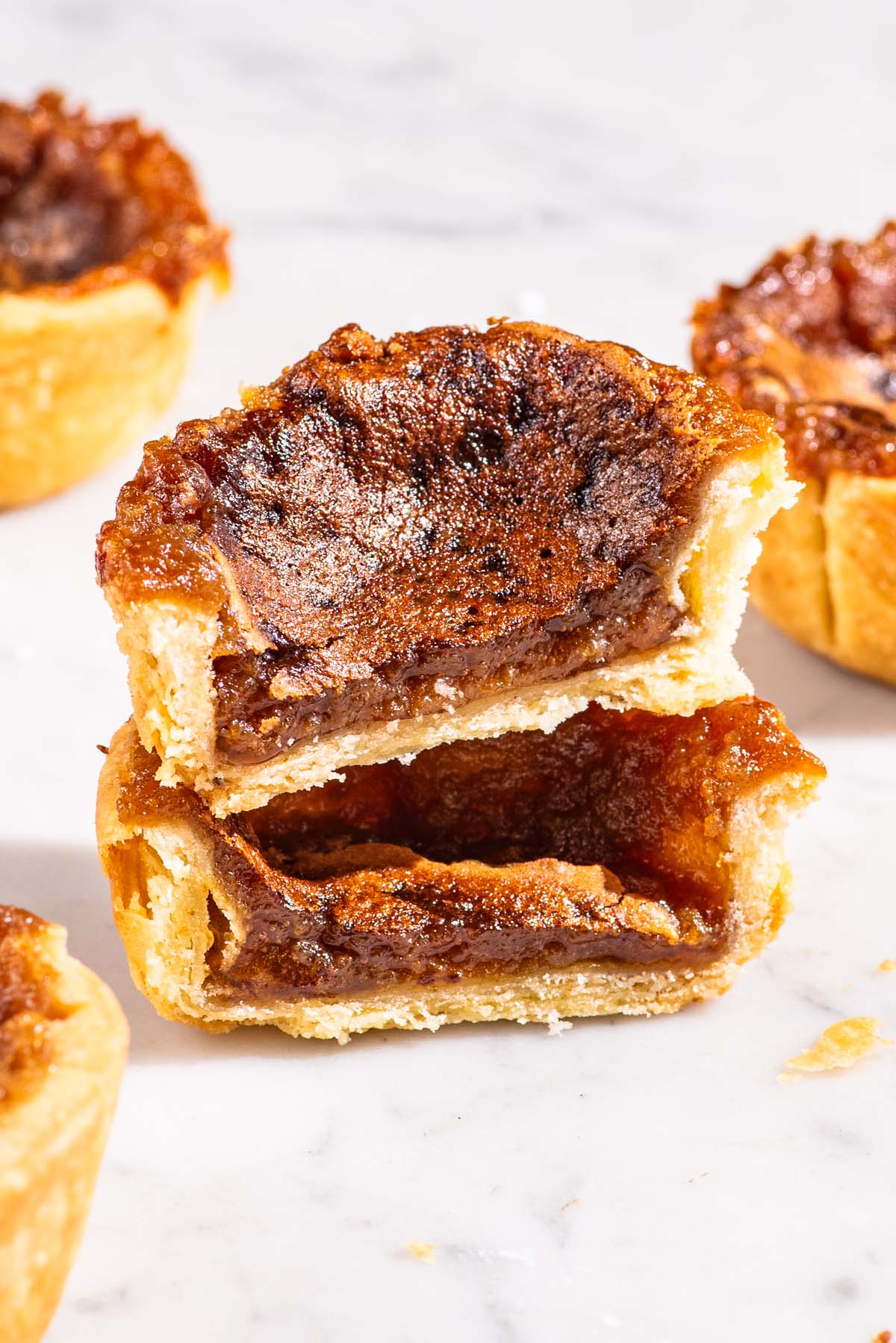 Small filled pastry, halved and stacked.