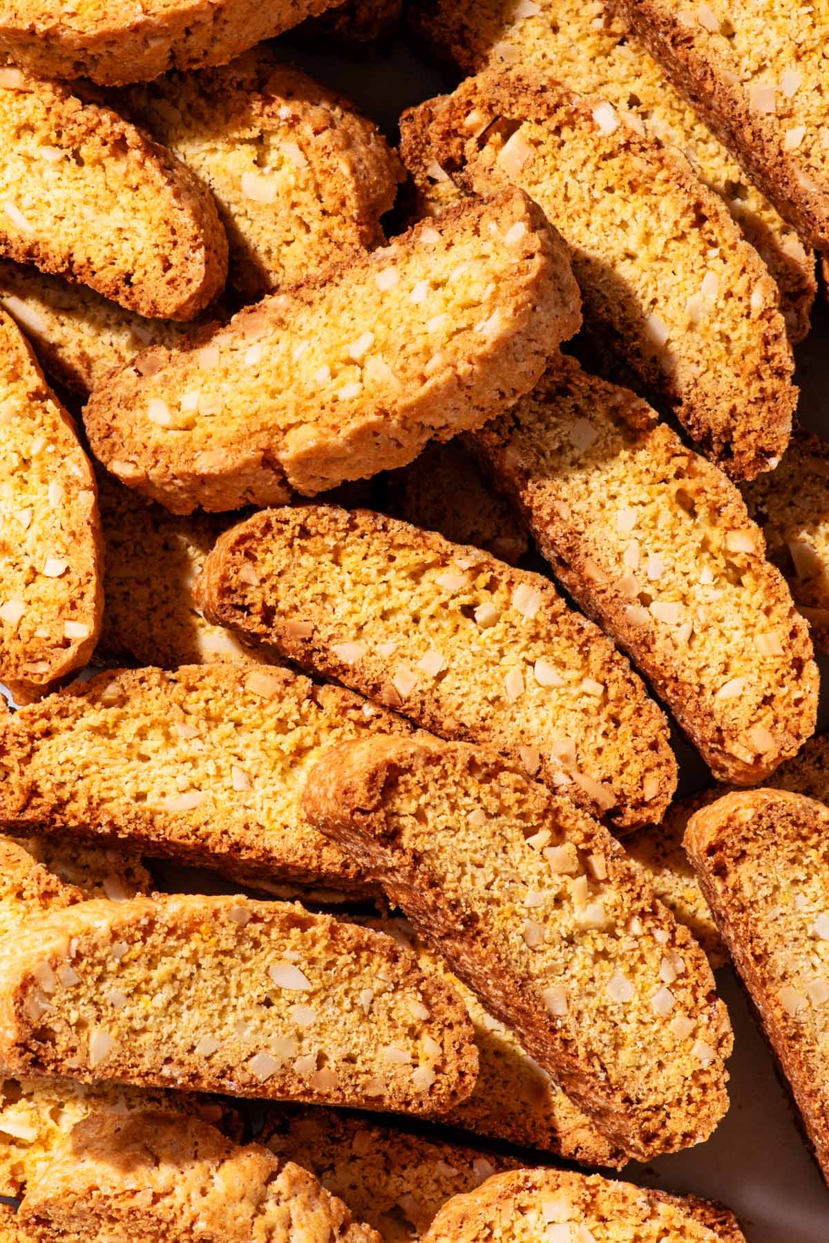 Several biscotti cookies all piled up together.